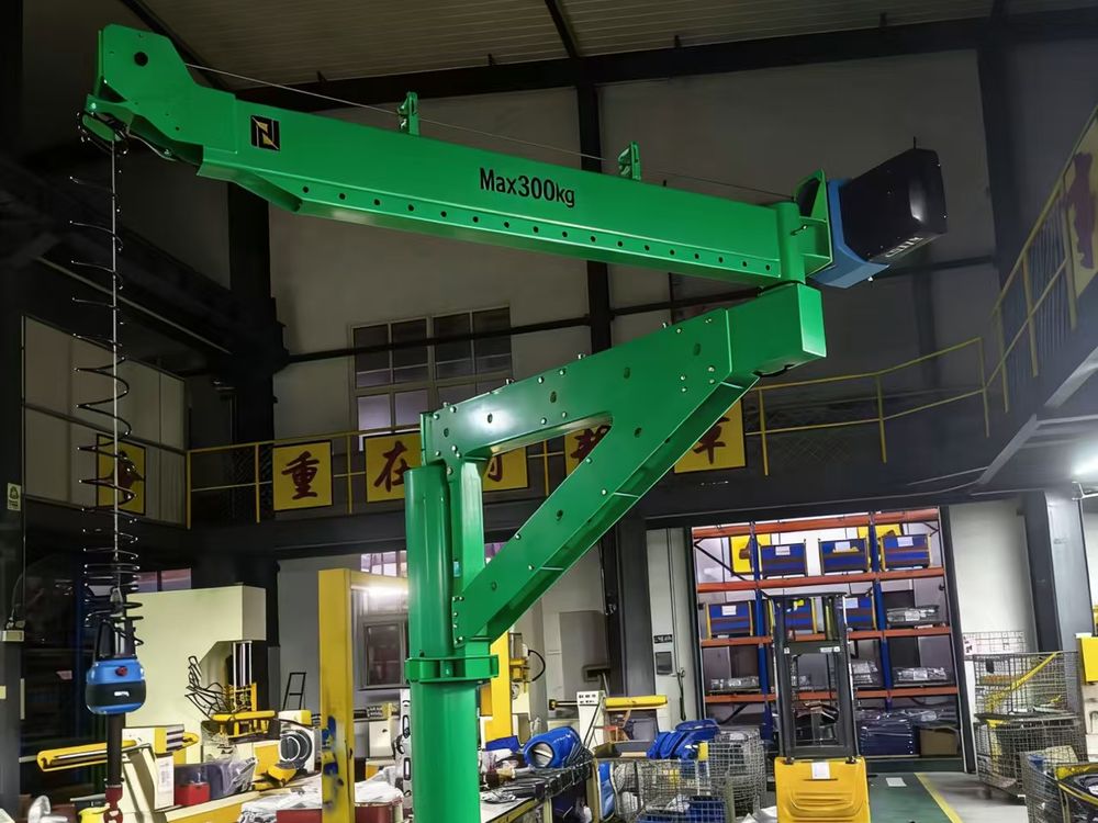 Articulated jib crane working between warehouse racking