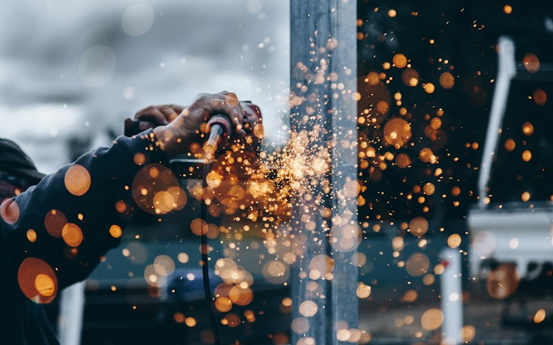 Sparks flying during custom steel fabrication